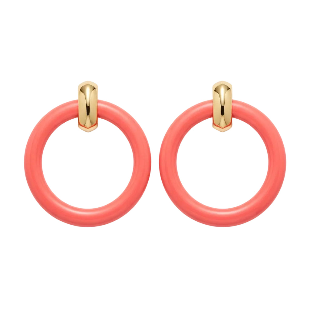A pair of coral pink doorknocker earrings with gold-toned metal connectors, from Kenneth Jay Lane.