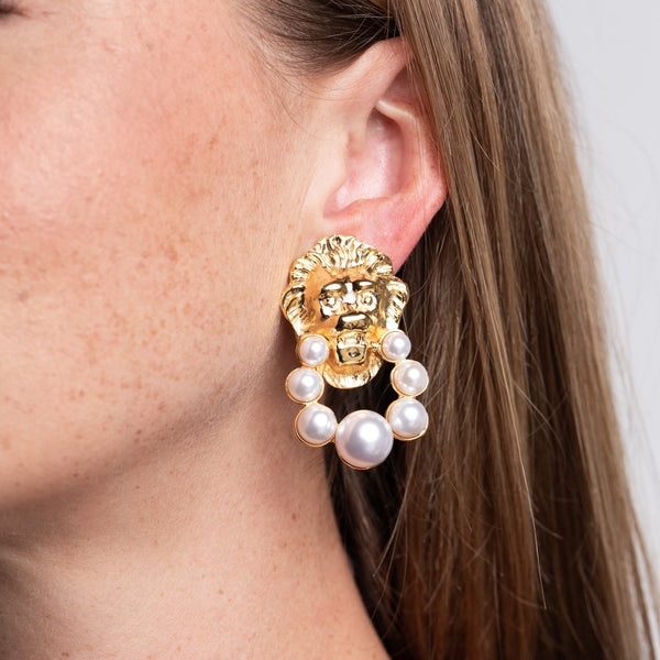 Lion Head and Pearl Earrings Regal Doorknocker Clip Earrings Kenneth Jay Lane Statement Earrings Majestic Lion Motifs Lustrous Pearl Accents Striking Clip-On Earrings Bold and Sophisticated Jewelry Unique Doorknocker Design Powerful Lion Head Charms Gift for Fashion Enthusiasts
