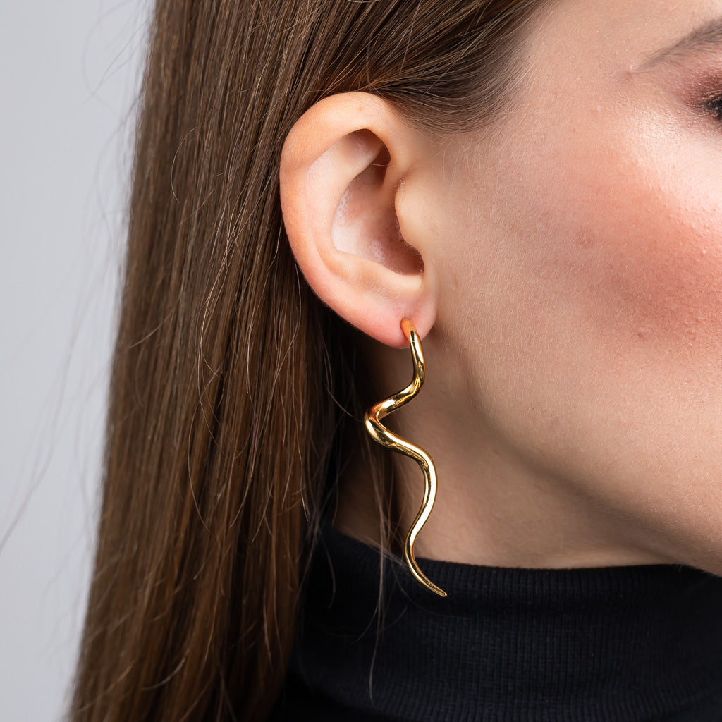 Polished Gold Swirl Pierced Earrings Elegance and Artistic Design Jewelry Kenneth Jay Lane Statement Earrings Chic Gold Swirl Patterns Lustrous Polished Gold Earrings Comfortable Pierced Style Earrings Versatile Sophisticated Accessories Modern Beauty Swirl Earring Set Gift for Style Enthusiasts Polished Gold Earrings with Swirl Designs