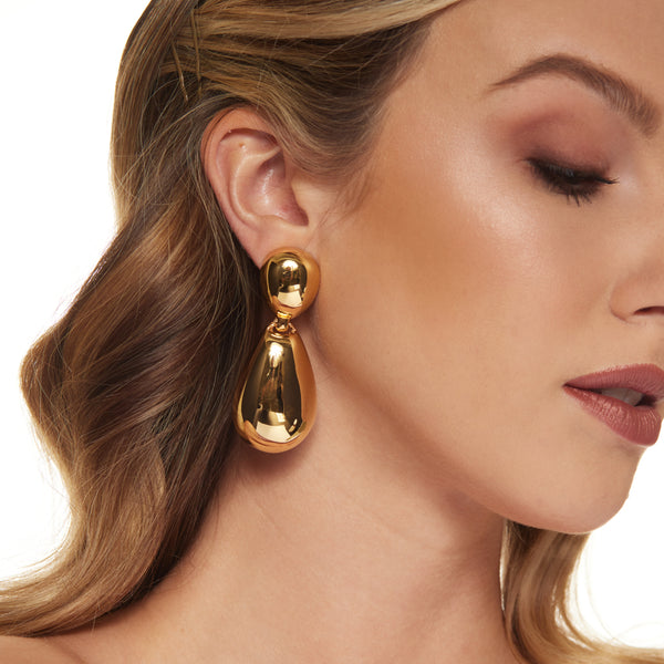 Polished Gold Drop Clip Earrings Elegance and Refinement Jewelry Kenneth Jay Lane Statement Earrings Chic Gold Drop Design Lustrous Polished Gold Earrings Comfortable Clip-On Style Versatile Sophisticated Accessories Modern Beauty Drop Earrings Gift for Style Enthusiasts Polished Gold Earrings with Elegant Drop Design