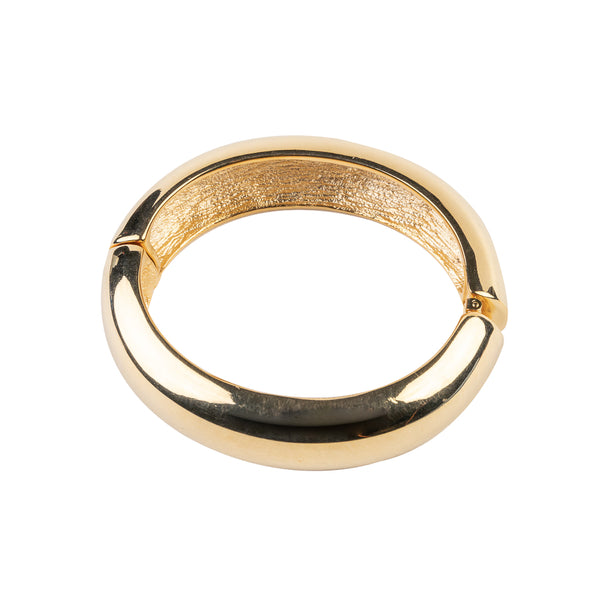 Kenneth Jay Lane 1/2-Wide Polished Gold Hinged Bracelet. A gold bracelet with a 1/2-inch wide band that is polished to a high shine.